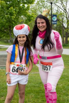 Mia, 9, and Marian Lanzillotti of Sussex were dressed as Super Mario characters. Mia won a medal for placing second in the Kids Mile.