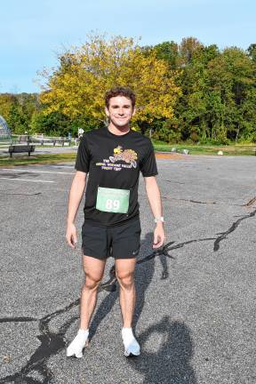 <b>John Russo of Milford, Pa., wins the 5K Family Run/Walk.</b>