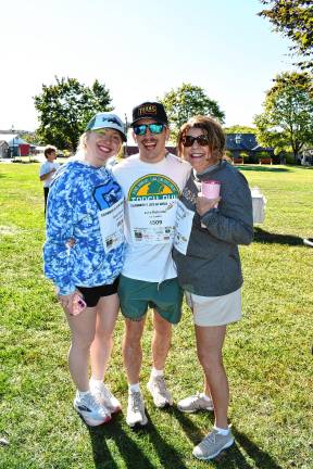 <b>Sarah Strutin of Hackensack and Jake and Colleen Rotunda of Franklin walk in memory of Colleen’s sister Carol, who died of cancer four years ago.</b>