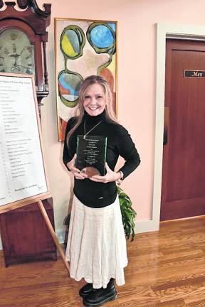 Kristy Vait of Curd &amp; Cleaver is shown with her New Business Award.
