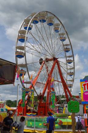 PHOTOS BY CHRIS WYMA What would a fair be without a Ferris wheel? The amusement park section of the New Jersey State Fair/Sussex County Farm and Horse Show was as busy as usual with both adults and their children sampling the rides.
