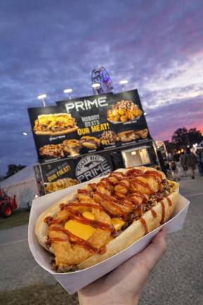 <b>Prime Beef Food Truck’s steak and cheese grinder topped with onion rings.</b>