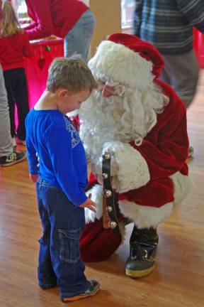 Nathaniel Vitale, 3, of Barry Lakes insisted on a one-on-one with Santa Claus.