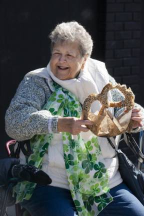 Kathy Brady of Vernon enjoys a large soft pretzel at the parade.