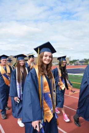 Gabrielle Miller marches in with the other graduates.