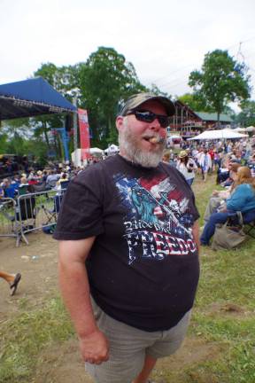 Music buff Don Van Dyk of Highland Lakes enjoyed some southern rock and a cigar on Saturday afternoon.