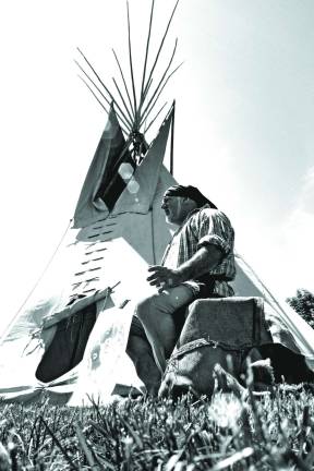 Buffalo Man Frank Diraimondo of Oakland teaches students about the art of building a teepee.