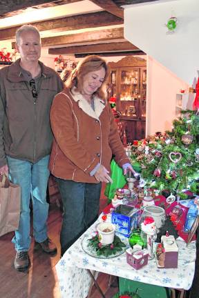 <b>Brian DAnzinger of Rockway and Karen Heenan of Hardyston look at Christmas ornaments.</b>