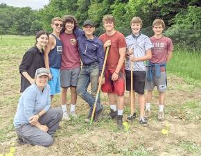 Erin Collins in front with Newton High School students (from left): Lilira Mecaj, Dom Megna, Christopher Mastrelli, Donovan Hetzel, Peter Weissensee, Dominick Gruca, and Matthew Kuever (Photo provided)