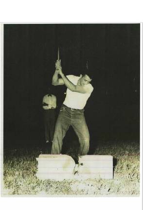 <b>Sayre participating in the fair’s chopping contest in 1947. He won the contest numerous times.</b>