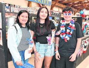 <b>Maria, Brislin and Alexander Lagunes of Sussex pose for a photo.</b>