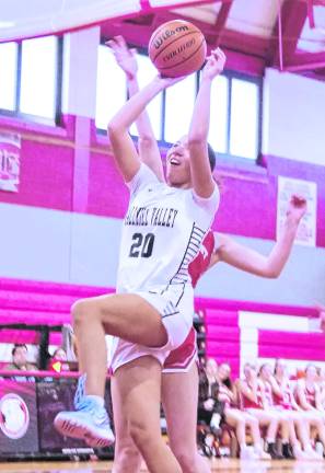 <b>Wallkill Valley's Jordyn Trinkleback (20) leaps during a shot. Trinkleback scored 12 points.</b>