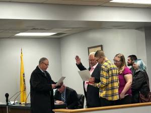 Assemblyman Parker Space, R-24, left, administers the oath of office to Sussex Borough Mayor Robert Holowach at the annual reorganization meeting Tuesday, Jan. 2. (Photos by Daniele Sciuto)