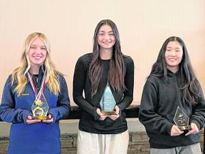 Vernon Township High School senior Gabbi Tavares, center, wins the Individual Combined State Championship in Girls Skiing. Junior Kelsey Callahan, left, finishes second. (Photo provided)