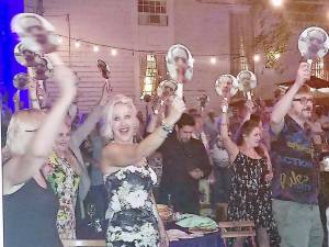 Handmade fans sporting a photo of Talent’s face were placed at each table