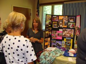 Lisa Mills talks to prospective members about the work of the Vernon Township Women's Club.