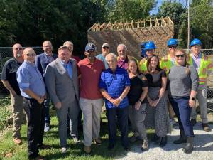 In front row, from left, are former Mayor Harry Shortway, Snow Partners chief executive Joe Hession, Mayor Howard Burrell, Councilman Patrick Rizzuto, Vernon business administrator Tina Kraus, township employee Jaclyn McCabe and township chief financial officer Donelle Bright. In back row, from left, are former Councilman Michael Furrey, Snow Partners chief legal officer Scott Baldassano, MUA member Edward Snook, township employee Howard Lazier, MUA member David McDermott, Coppola Services project manager Patrick Mercogliano, Andrew Pitsker and Mike Coppola. (Photo by Bryan Fumagalli)