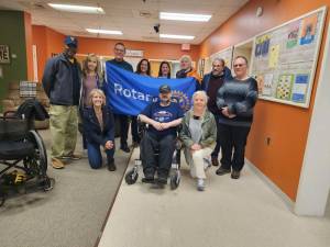 Vernon Rotary Club members pose at a ceremony where they donated a long-range motorized wheelchair for adults to the township. In the top row, from left, are Mayor Howard Burrell, Mishelle Downtain, Andrew Pitsker, Keren Gonen, Theresa Markham, Peter Warren, Dr Pasquale Yaccarino and Rich Populaski. In the bottom row, from left, are Susan DeRrocco, Michael Szymczak and Rosemary Polhemus. (Photo provided)