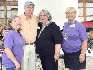 Snufftown president Rose Wolverton, Bruce Crawford, Onnolee Allieri and Snufftown program coordinator Sue Mortensen gather for a group photo.