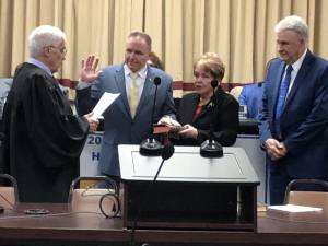 Anthony Rossi takes the oath of office as Vernon’s mayor during the Township Council’s annual reorganization meeting Monday, Jan. 15. At right are his parents, Harriett and Anthony. (Photo by Kathy Shwiff)