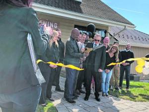 Brian Dowling, chief executive and founder, cuts the ribbon to open Sussex Cultivation’s processing facility in Vernon. At left is former Mayor Howard Burrell and at right is Mayor Anthony Rossi. (Photos by Kathy Shwiff)
