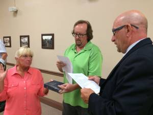 Mayor Harry Shortway swears in new Environmental Commission chairwoman Sally Rinker and second Environmental Commission alternate Michael Furrey