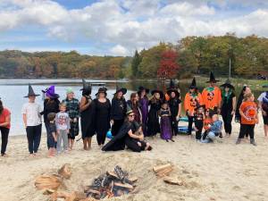 <b>A coven of “witches” pose on the shore of Lake 1 in Highland Lakes.</b>