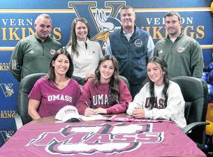 <b>Vernon Township High School senior is shown with, standing, from left, her father, girls’ soccer coach Casey Jacoby, Athletic Director Bill Foley, Athletic Trainer Matt McKowen; her mother, and sister Vanesa are seated.</b>