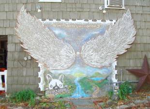 This mural can be viewed on the side wall of the Daily Bean Cafe entitled Wings of Vernon.