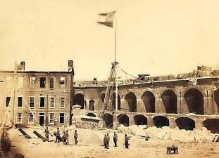 A photo of the Confederate flag flying over Fort Sumter, a detail from a stereoscopic photograph taken by Alma A. Pelot on the morning of April 15, 1861.