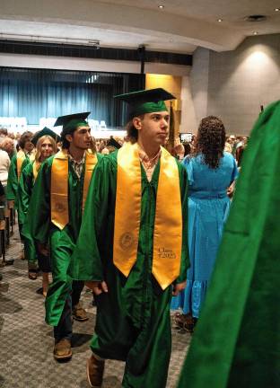 Graduates walk out after the ceremony.