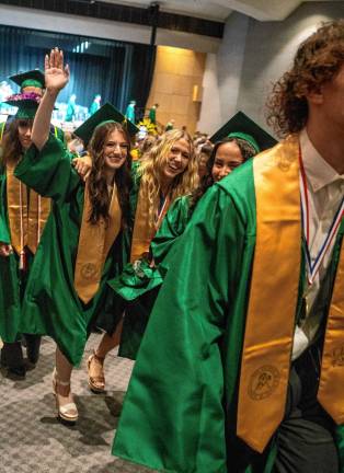 Graduates walk out after the ceremony.