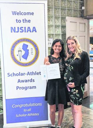 <b>Senior Uriah Sacdalan was Vernon’s representative at the annual NJSIAA Scholar Athlete Luncheon held at the Pines Manor in Edison this past Sunday (May 17). Uriah is currently second in the class and participates in the Girls’ Wrestling and Golf Teams. Pictured with Uriah is head wrestling coach Ashley Gocklin.</b>