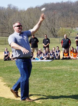 Committeeman Jon Morris throws the Ceremonial First Baseball Pitch.