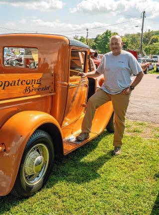 <b>Paul Mannerberg poses by a 1931 Model A Ford.</b>