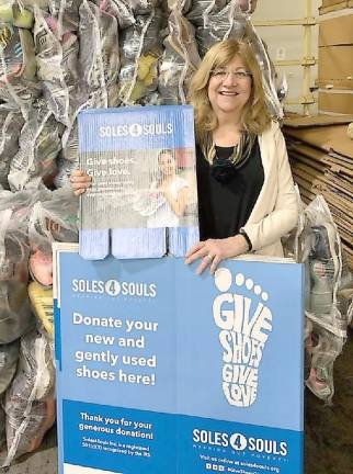 Karen Rothstadt, International Relations Committee chairperson for the Vernon Township Woman's Club, holds Soles4Souls boxes for the club's shoe drive that will be launched after the stay-at-home order is lifted.
