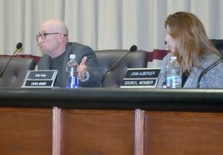 Vernon Township Council President Harry Shortway talks about short-term rentals on Monday as Councilwoman Kelly Weller, right, looks on during Monday night's meeting.