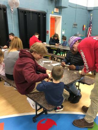 High school students build with preschoolers