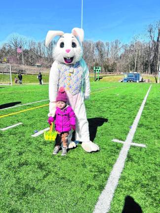 Autumn Kane, 2 1/2, of Highland Lakes poses with the Easter Bunny on Sunday, March 24 during the annual Easter Egg Trail at Maple Grange Park in Vernon. (Photos by Daniele Sciuto)