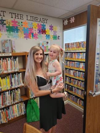 Franklin residents Danielle Watson-Quigley and her daughter, Avery Quigley, visited the local library Saturday, June 24 for the opening of the summer reading program.
