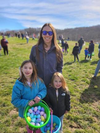 From left, Lacey, 6, and Lexie Landgraff, 4, with their mother, Megan.