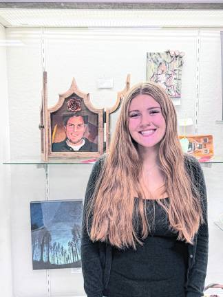 Scholarship and second place in painting winner, Destiny Cerracchio with her piece, “With You,” honoring her late uncle.