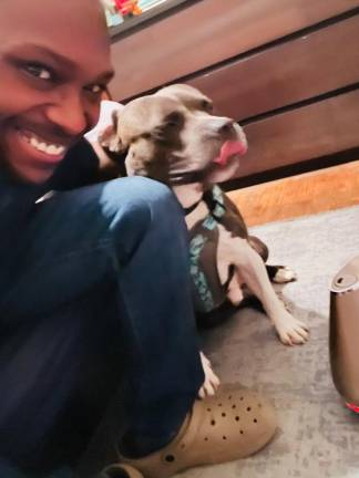 Coqunetay Glenn is happy to have his dog, Savage, home from New Jersey. (Photo provided by Coqunetay Glenn)