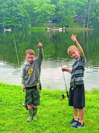 Jaxon Babcock, 8, left, and his brother Brendon, 10, of Wantage show off the sunfish they caught.