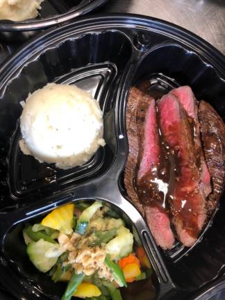 Each meal included Pat LaFrieda london broil, homemade mashed potatoes, and fresh vegetables.