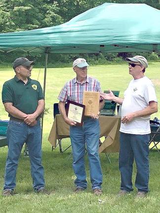 Elmer Platz receives recognition for his work in forest management.