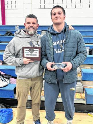 <b>Long-time Assistant Boys Wrestling Coach, John Loggie, was awarded the Assistant Coach of the Year Award at the District tournament.</b>