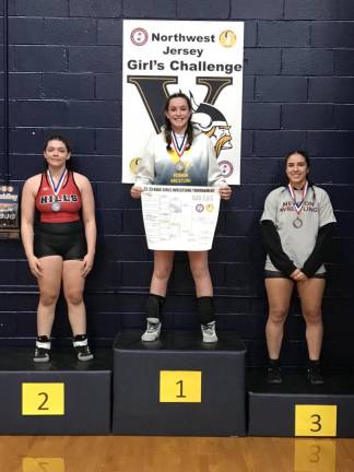 Vernon Township High School sophomore Caitlin Hart, center, placed third at 185 pounds in the NJSIAA girls wrestling championships in Atlantic City.