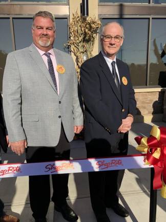Wantage Mayor Jon Morris, left, and Sussex Mayor Edward Meyer stand in front of the new ShopRite of Sussex on Wednesday, Oct. 25. (Photo by Kathy Shwiff)