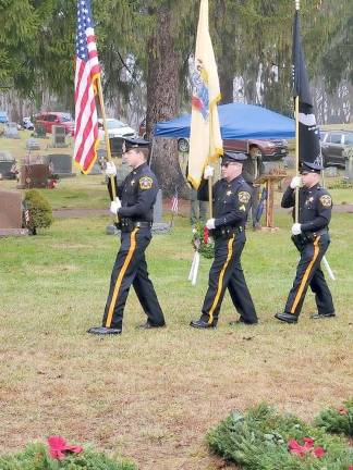 Sussex County Sheriff’s Honor Guard Unit walking with flags.